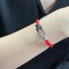 692ff50399f2d84055c8dd61 New Release ❤️ Fred Large Black and White Diamond Horsehoof Charm Red String Bracelet - Luxury Fashion Elegant Design