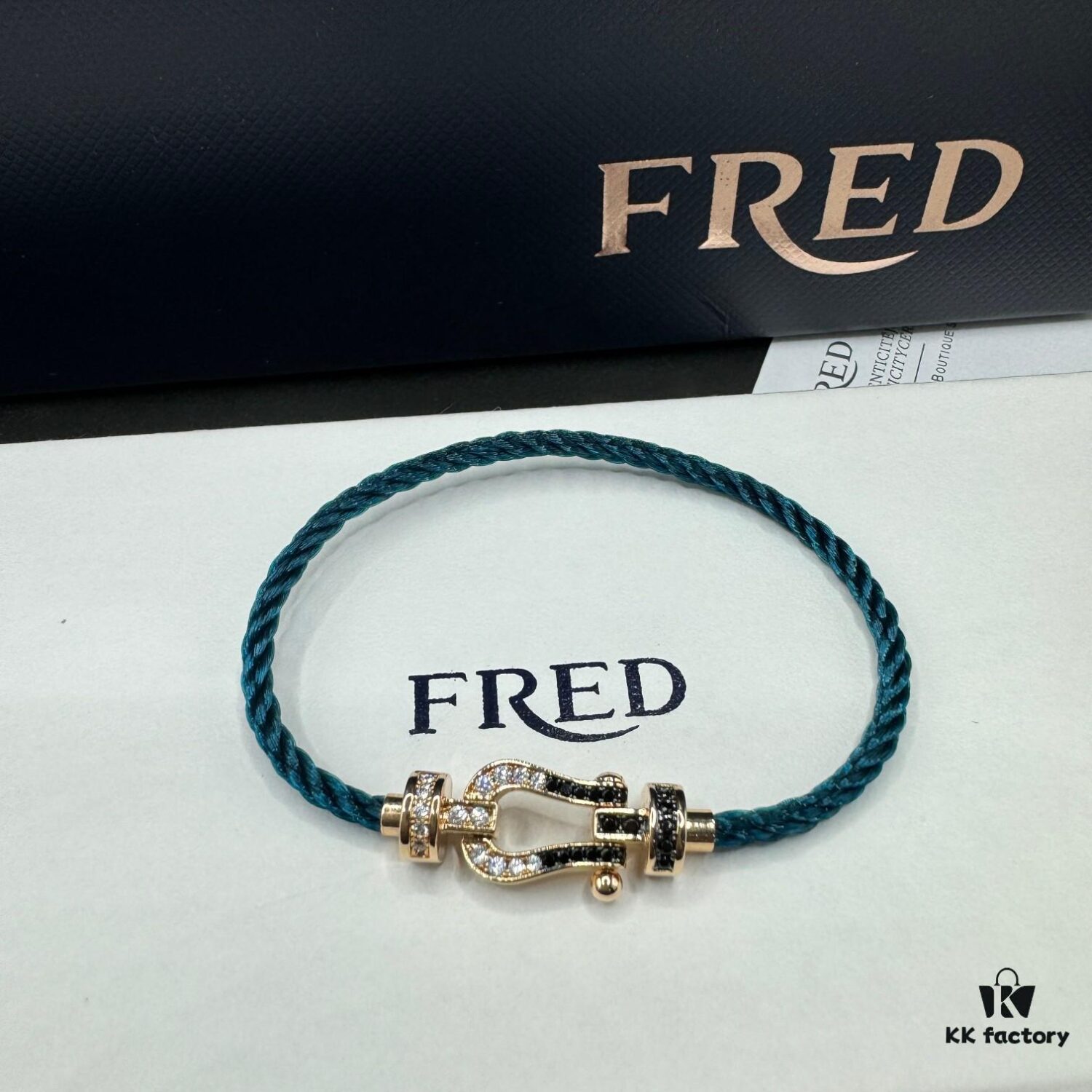 692ff65f99f2d84055c8df64 FRED Fred Bracelet, Medium Rose Gold Force 10 Collection with Black and White Gemstones, Steel Cord Bracelet
