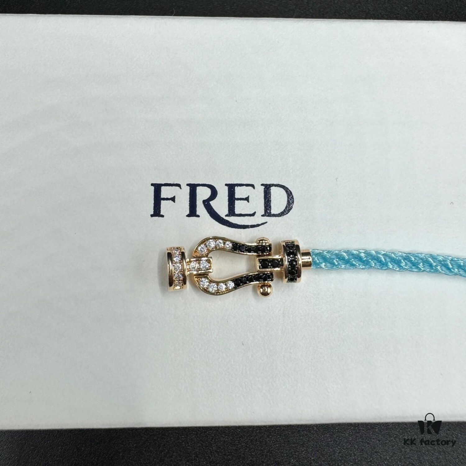 692ff66499f2d84055c8df69 FRED Force 10 Bracelet in Rose Gold, Medium Size, with Black and White Gemstones, Steel Cord Design