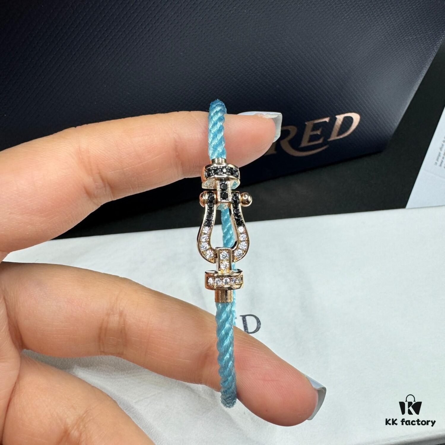 692ff66499f2d84055c8df6a FRED Force 10 Bracelet in Rose Gold, Medium Size, with Black and White Gemstones, Steel Cord Design