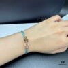 692ff66699f2d84055c8df6d FRED Force 10 Bracelet in Rose Gold, Medium Size, with Black and White Gemstones, Steel Cord Design