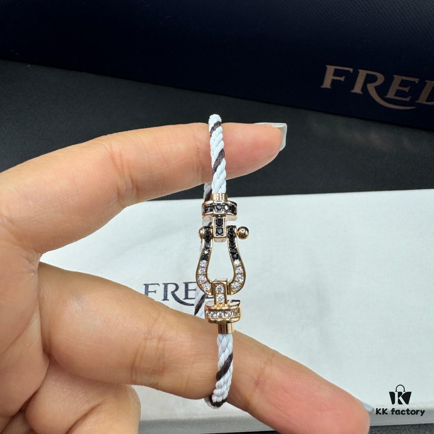 692ff67699f2d84055c8df7d FRED Force 10 Bracelet in Rose Gold, Medium Size with Black and White Gemstones, Steel Cord Design