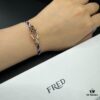692ff67a99f2d84055c8df83 FRED Force 10 Bracelet in Rose Gold, Medium Size with Black and White Gemstones, Steel Cord Design