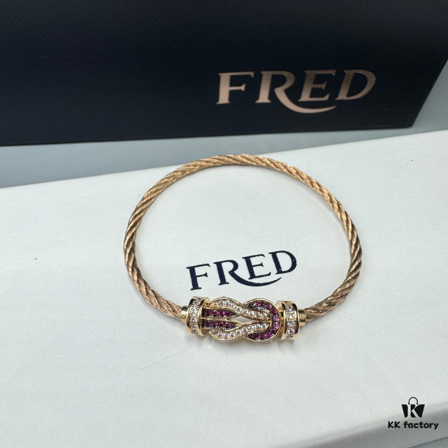 692ff68499f2d84055c8df91 FRED Force 10 Bracelet in Rose Gold, Medium Size with Ruby Cabochon and Stainless Steel Cable