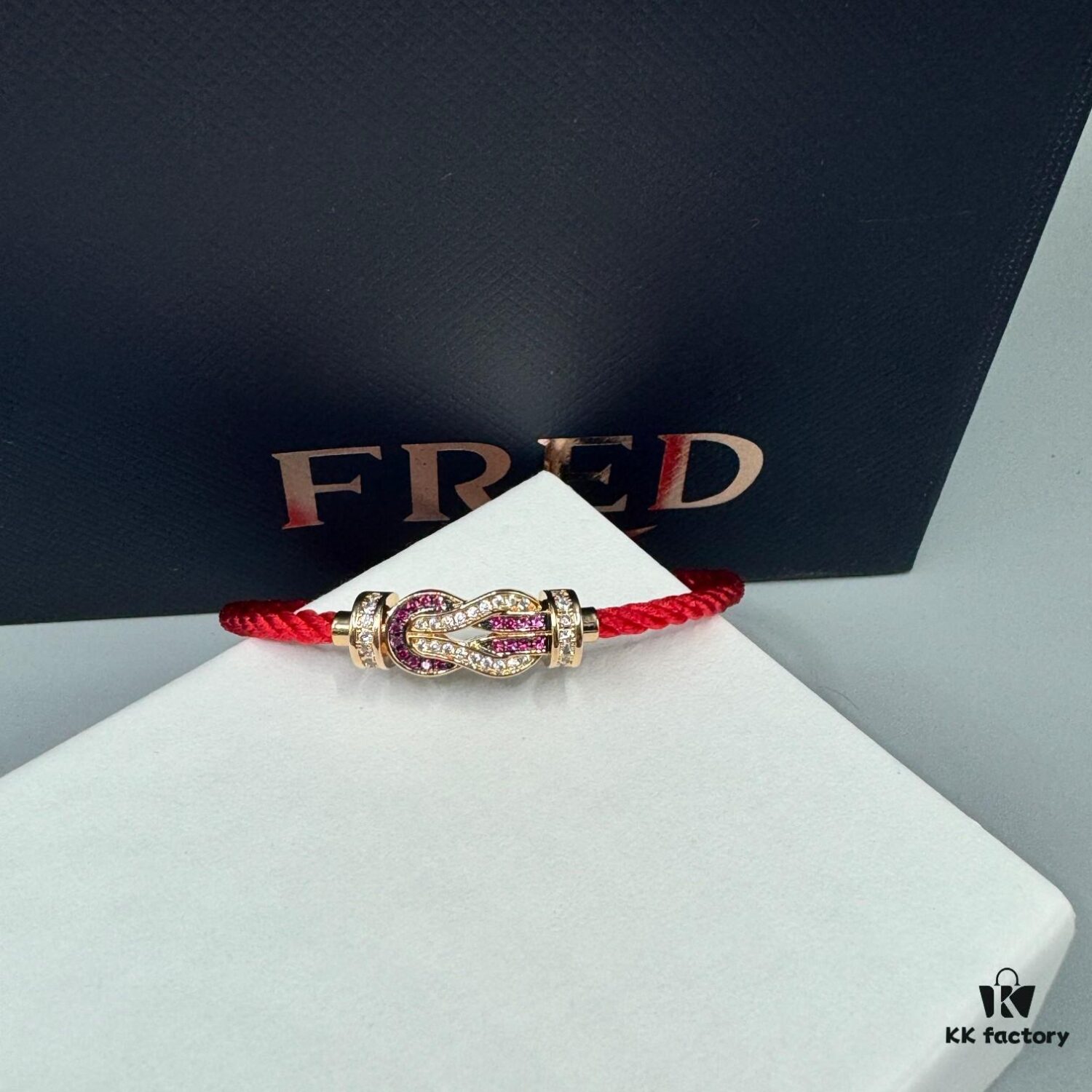 692ff68f99f2d84055c8df9f FRED Force 10 Bracelet in Rose Gold with Ruby, Medium Size, Red Sapphire Model, Steel Cord Design