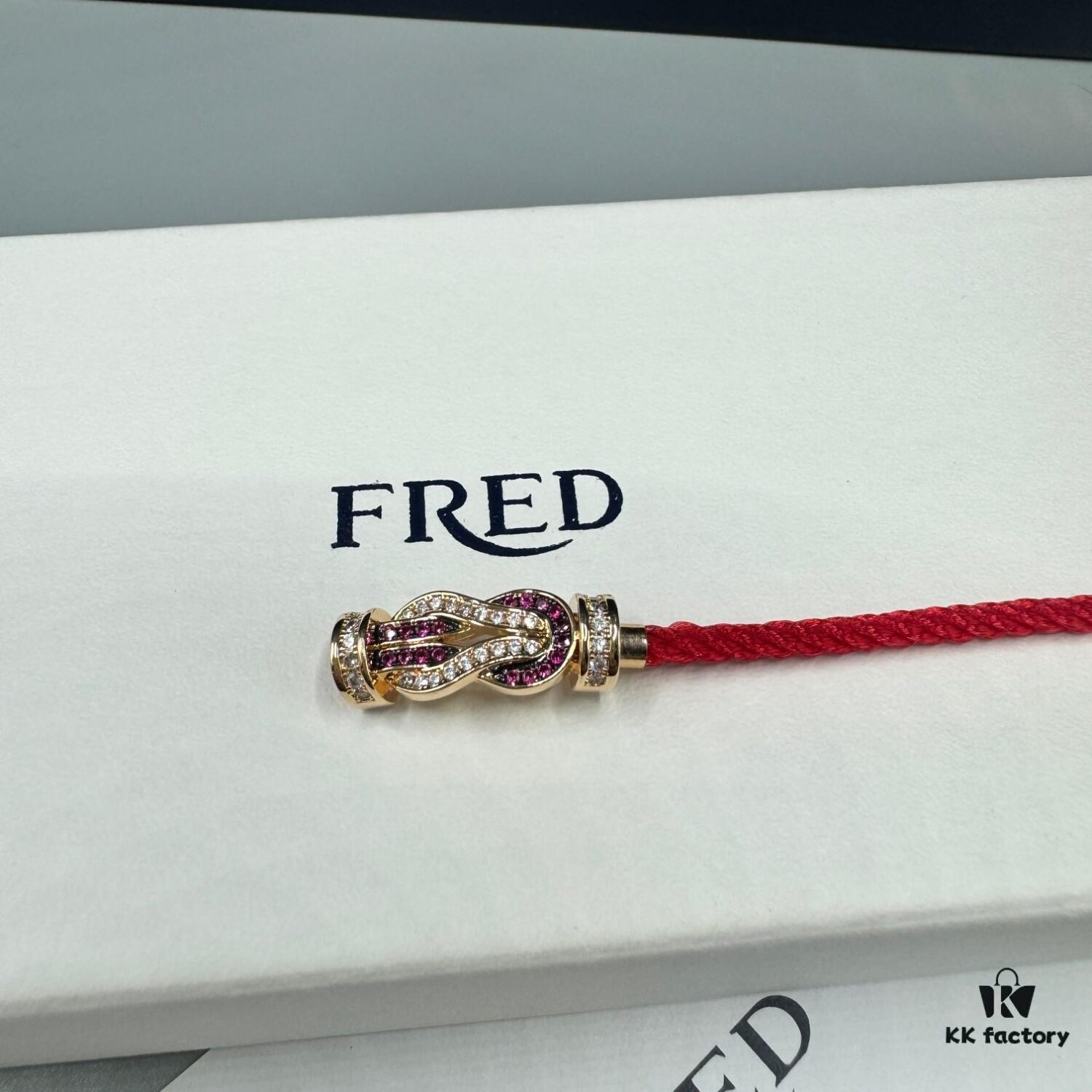 692ff69099f2d84055c8dfa2 FRED Force 10 Bracelet in Rose Gold with Ruby, Medium Size, Red Sapphire Model, Steel Cord Design