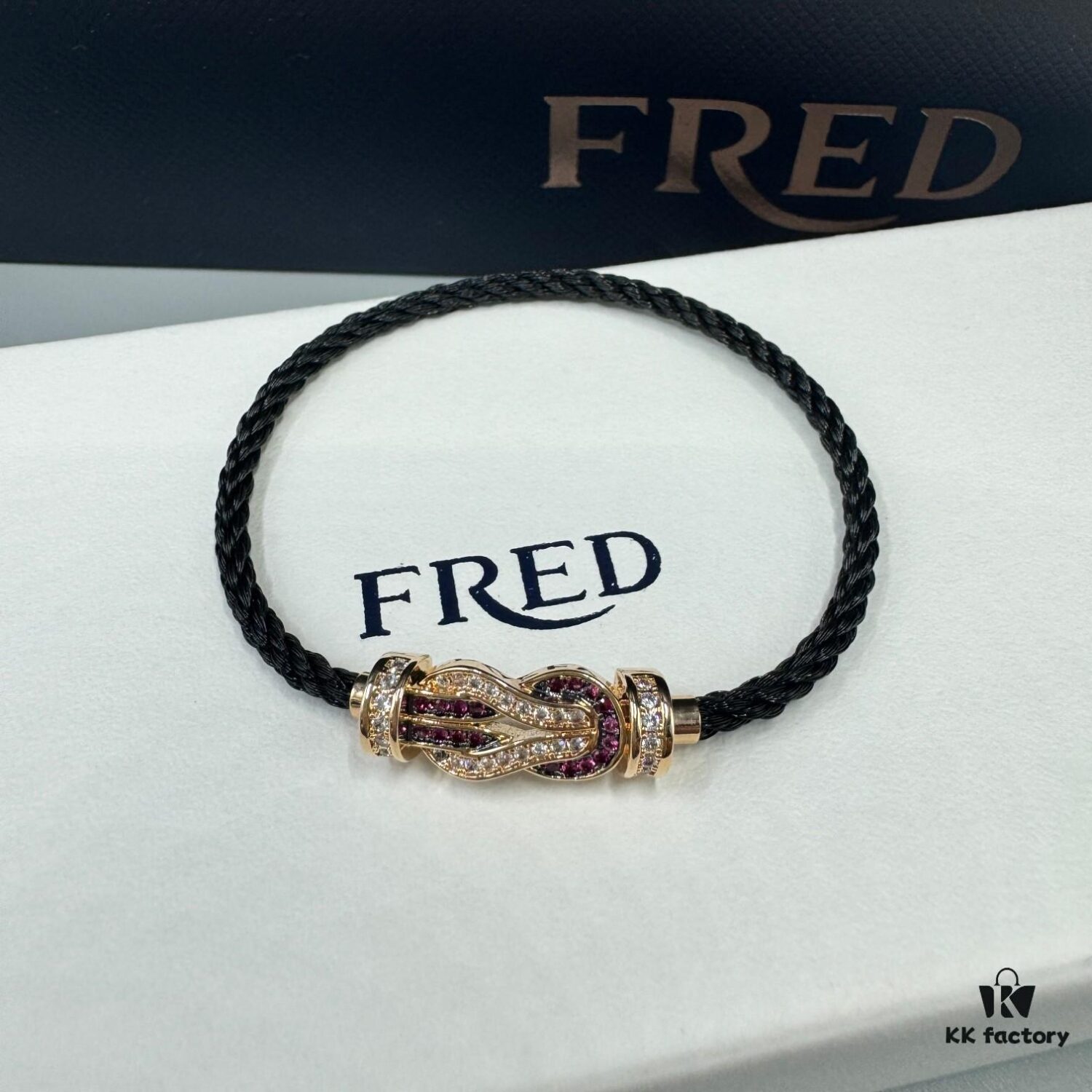 692ff69399f2d84055c8dfa5 FRED Force 10 Bracelet in Rose Gold, Medium Size with Ruby Cabochon and Steel Cable