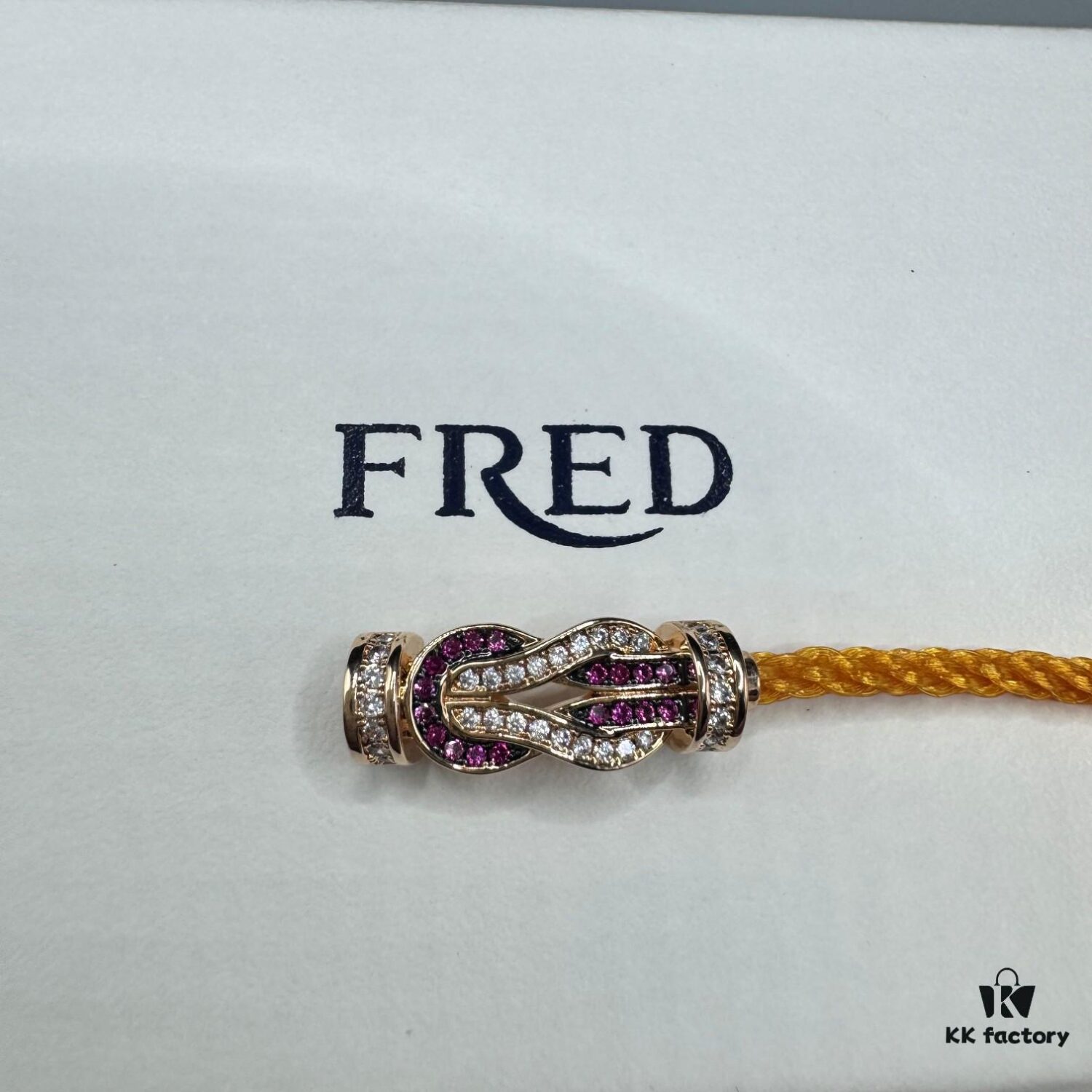 692ff69c99f2d84055c8dfb0 FRED Force 10 Bracelet in Rose Gold, Medium Size with Ruby Cabochon and Stainless Steel Cord