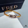 692ff69e99f2d84055c8dfb2 FRED Force 10 Bracelet in Rose Gold, Medium Size with Ruby Cabochon and Stainless Steel Cord