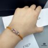 692ff6a099f2d84055c8dfb5 FRED Force 10 Bracelet in Rose Gold, Medium Size with Ruby Cabochon and Stainless Steel Cord
