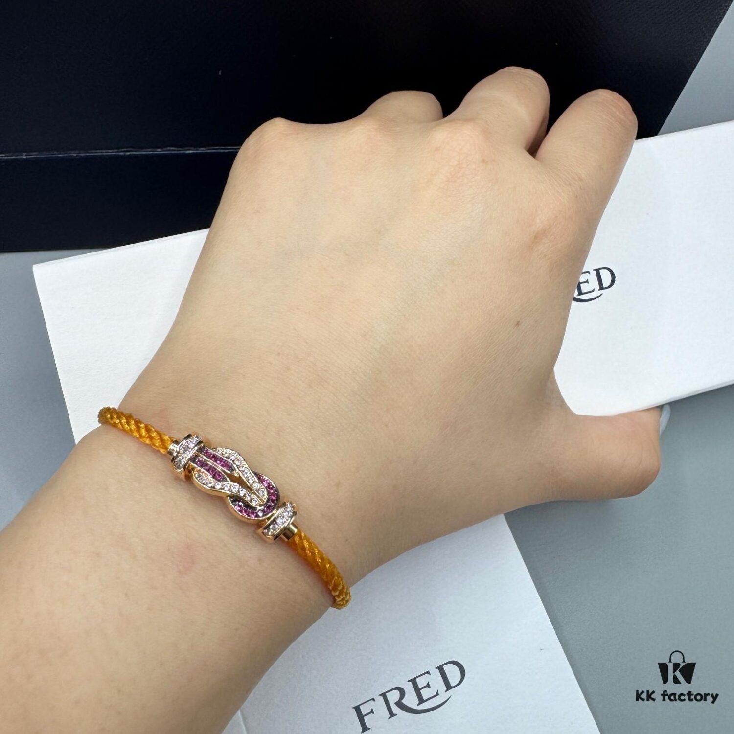 692ff6a099f2d84055c8dfb5 FRED Force 10 Bracelet in Rose Gold, Medium Size with Ruby Cabochon and Stainless Steel Cord