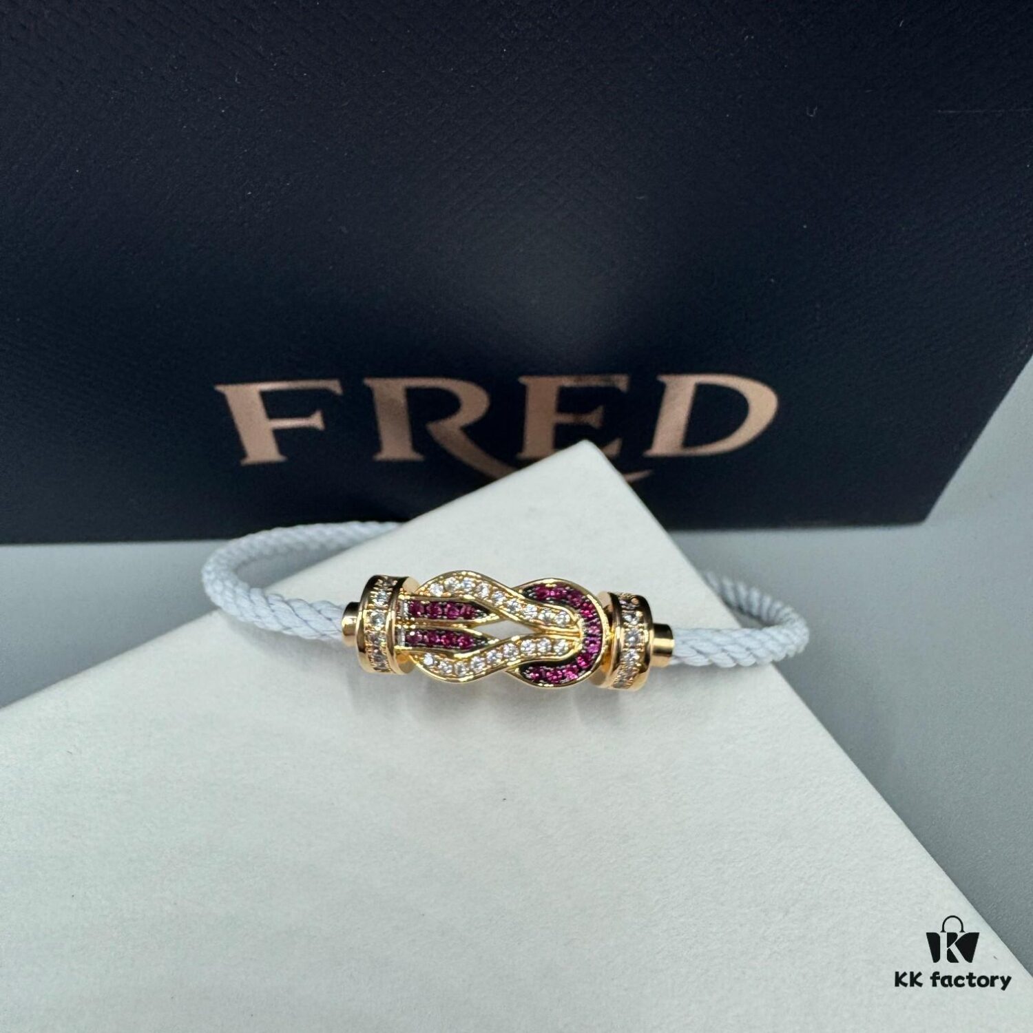 692ff6a299f2d84055c8dfb8 FRED Force 10 Bracelet in Rose Gold with Ruby, Medium Size, Stainless Steel Cord