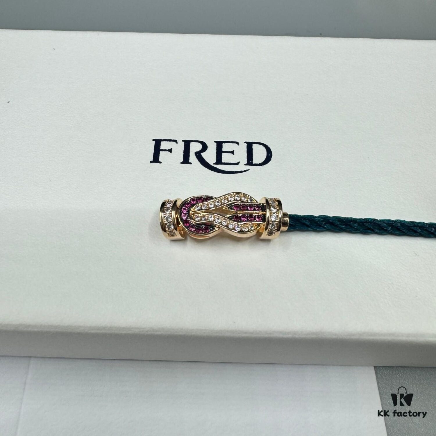 692ff6a799f2d84055c8dfbd FRED Force 10 Bracelet in Rose Gold with Ruby, Medium Size, Red Gemstone Slide Buckle, Steel Cable Design
