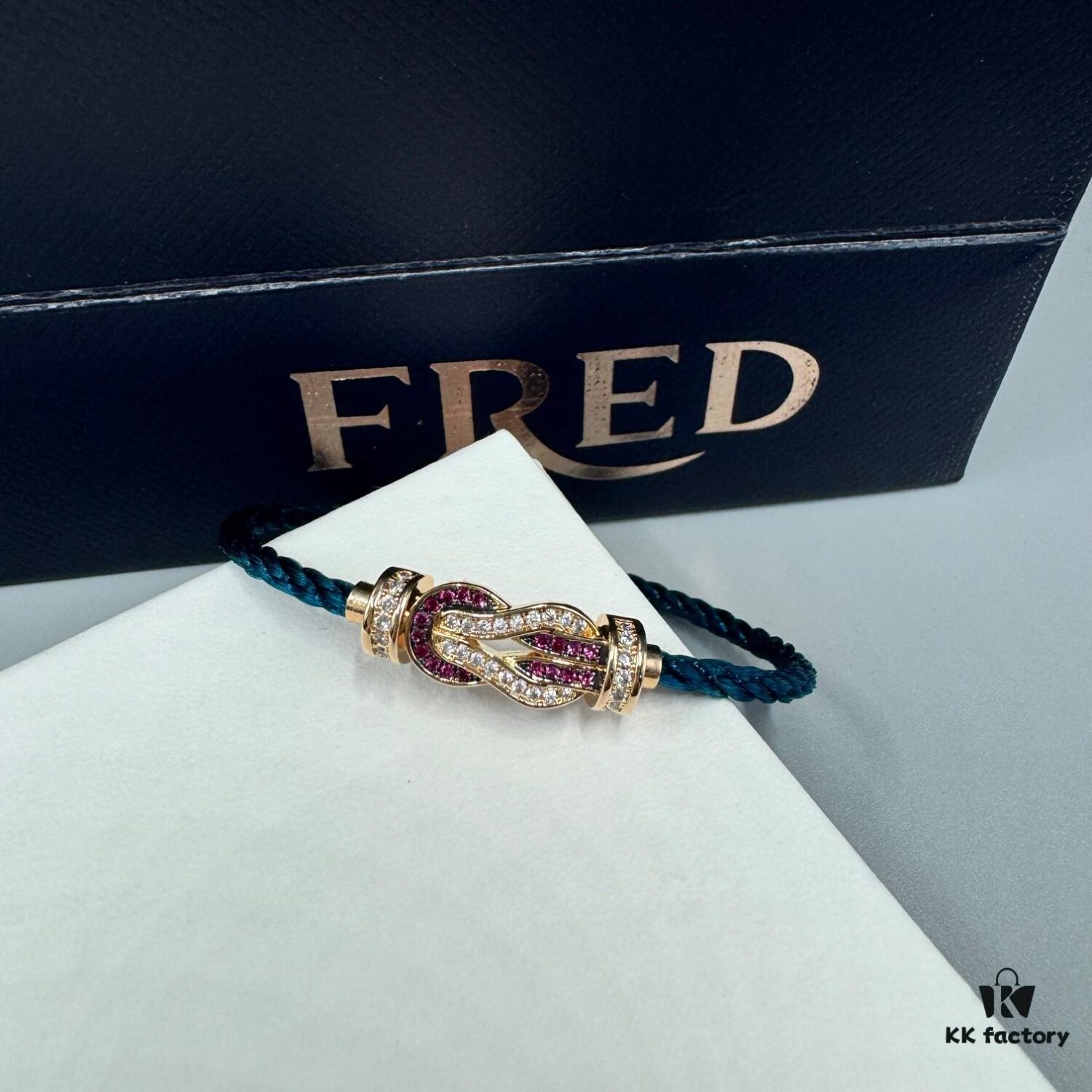 692ff6ad99f2d84055c8dfc6 FRED Force 10 Bracelet in Rose Gold with Ruby, Medium Size, Red Gemstone Slide Buckle, Steel Cable Design