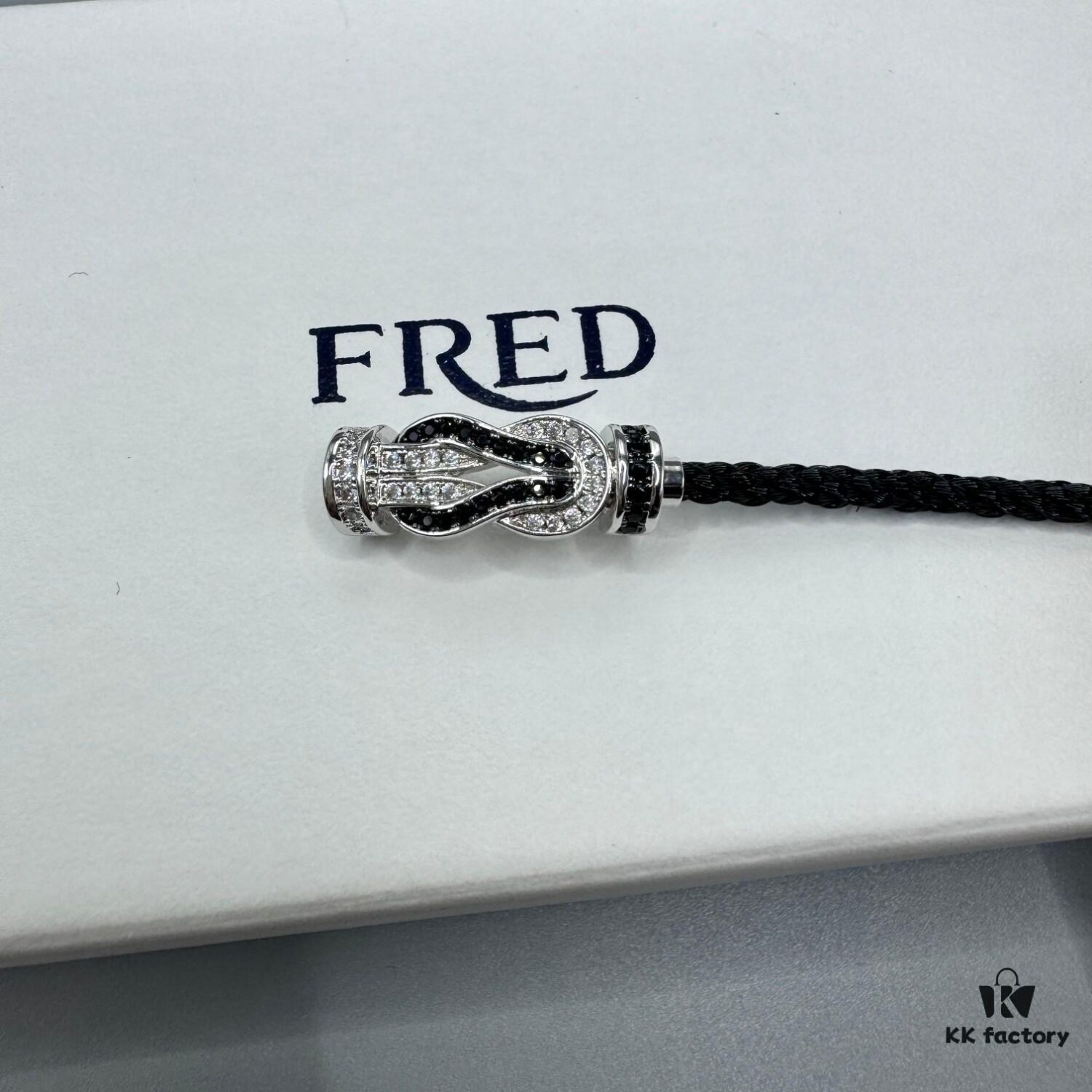 692ff6bf99f2d84055c8dfdd FRED Force 10 Bracelet in Platinum Medium Size with Panda Motif, Black and White Design, Steel Clasp and Black Cord