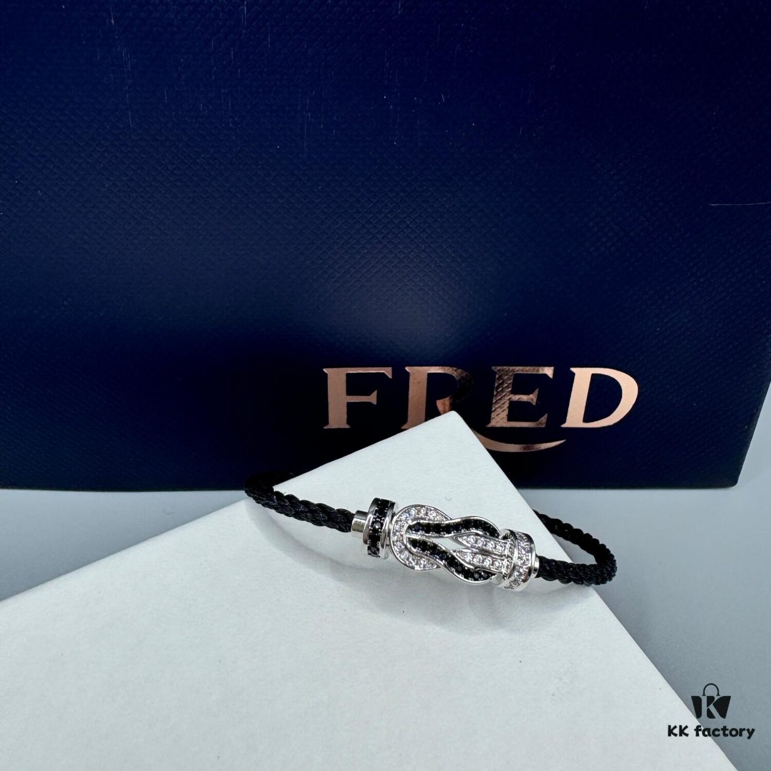 692ff6dd99f2d84055c8dff9 FRED Force 10 Bracelet in Platinum Medium Size with Panda Motif, Black and White Design, Steel Clasp and Black Cord