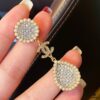 692ffc6199f2d84055c8e7a1 Xiaoxiang New Sunflower Earrings, Luxury Full Diamond Pearl Drop Design, Elegant and Stylish for Daily Wear