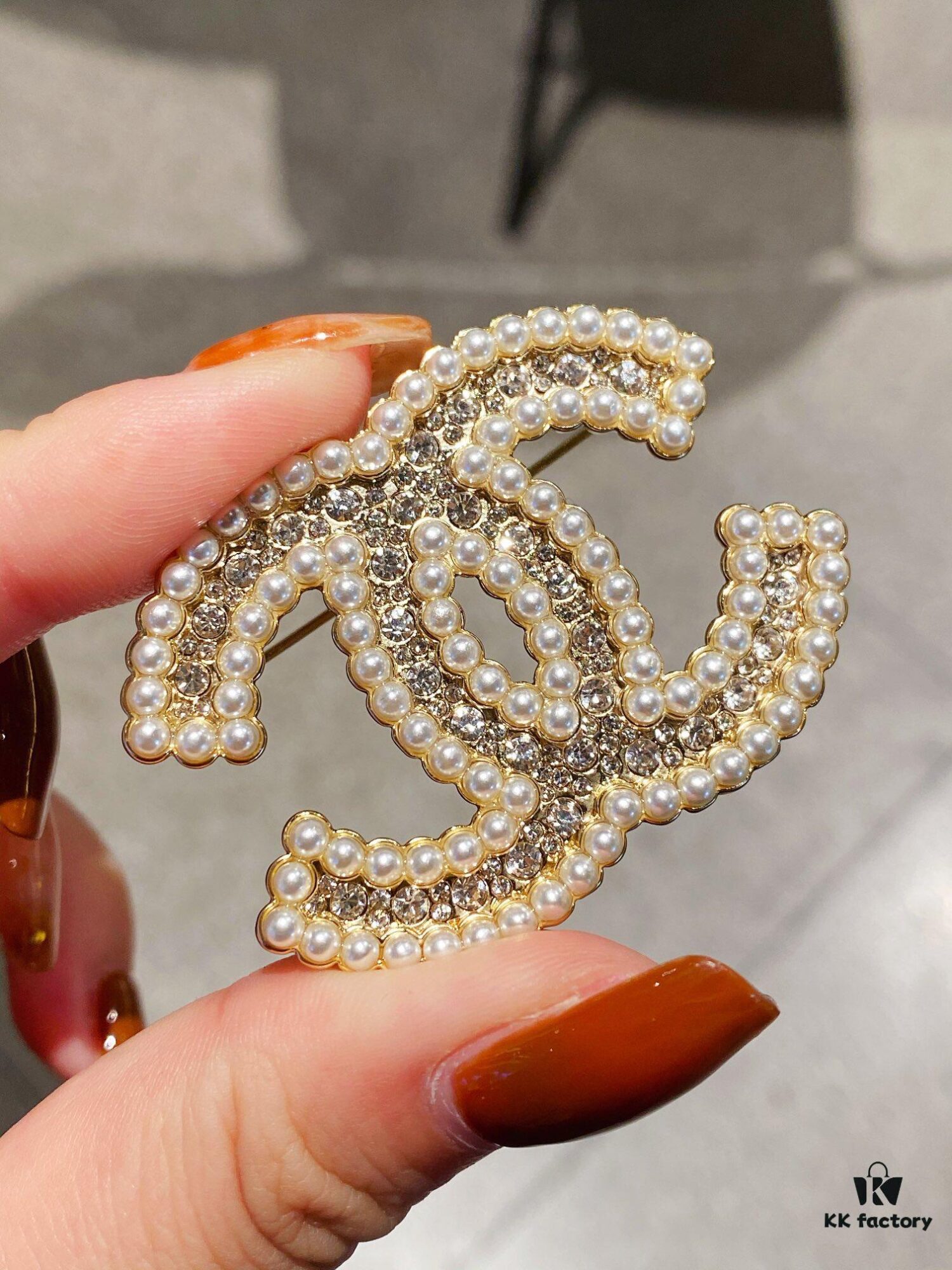 692ffc7e99f2d84055c8e7b6 Xiaoxiang New Pearl Brooch, Small Pearl Trim Design with Full Rhinestone Double C Shape