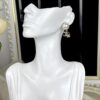 692ffc9999f2d84055c8e7d3 Chanel New Arrival Pearl and Floral Earrings