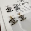 692ffd5699f2d84055c8e8d8 Xiaoxiang New Arrival Gold and Silver Two-Tone Luxury Double C Leather-Embedded Earrings