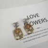 692ffd8199f2d84055c8e917 Xiaoxiang New Rectangular Picture Frame Surrounding Flower Colorful Rhinestone Hollow Pendant Earrings