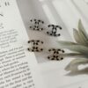 692ffd8e99f2d84055c8e929 Xiaoxiang New Arrival Black Drip Oil Rhinestone Classic Earrings, Available in Gold and Silver
