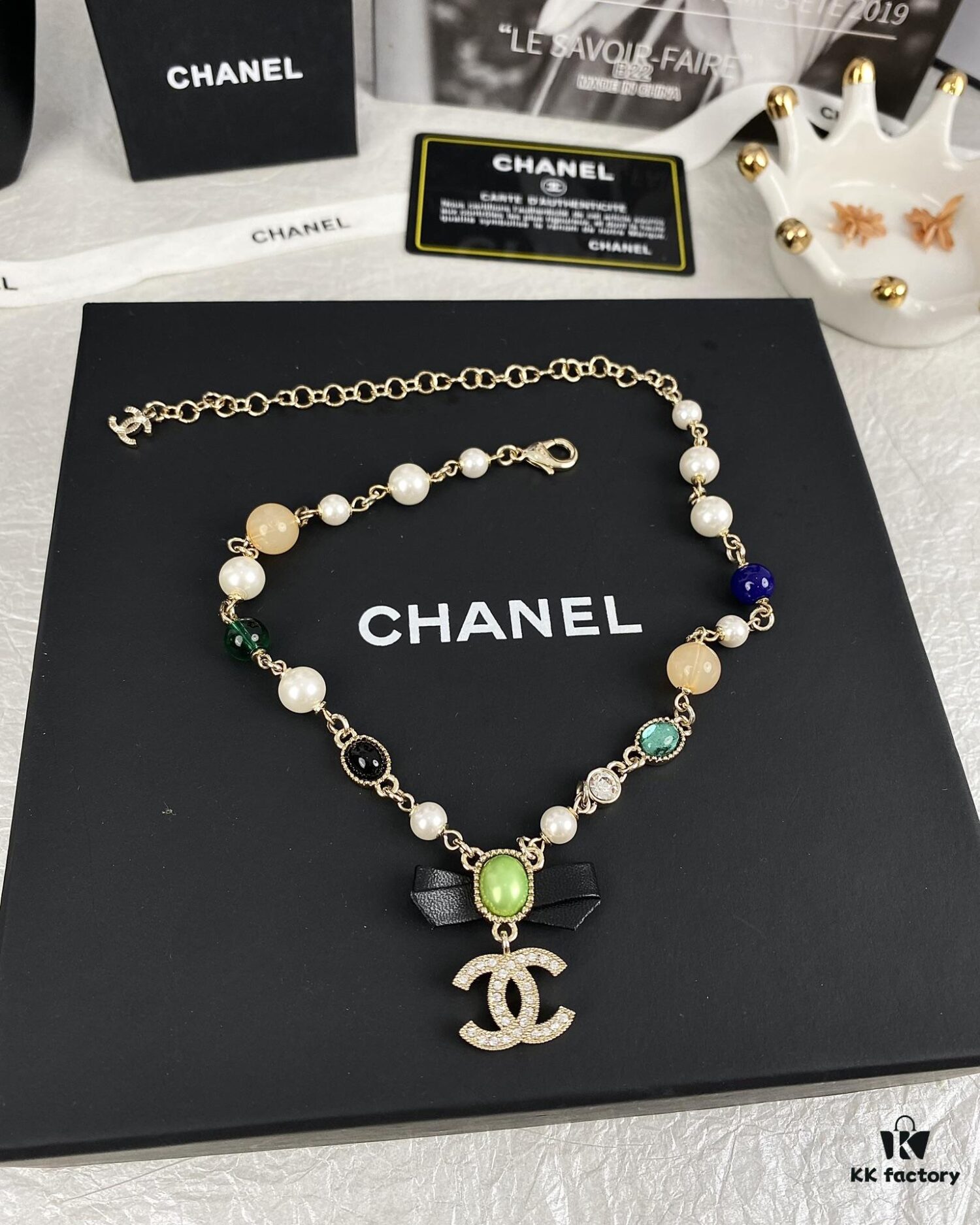 692ffdd599f2d84055c8e97b Xiaoxiang New Arrival Black Ribbon Bow with Green Pearl Pendant, Colorful Paved Diamond Necklace