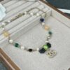692ffdd699f2d84055c8e97e Xiaoxiang New Arrival Black Ribbon Bow with Green Pearl Pendant, Colorful Paved Diamond Necklace