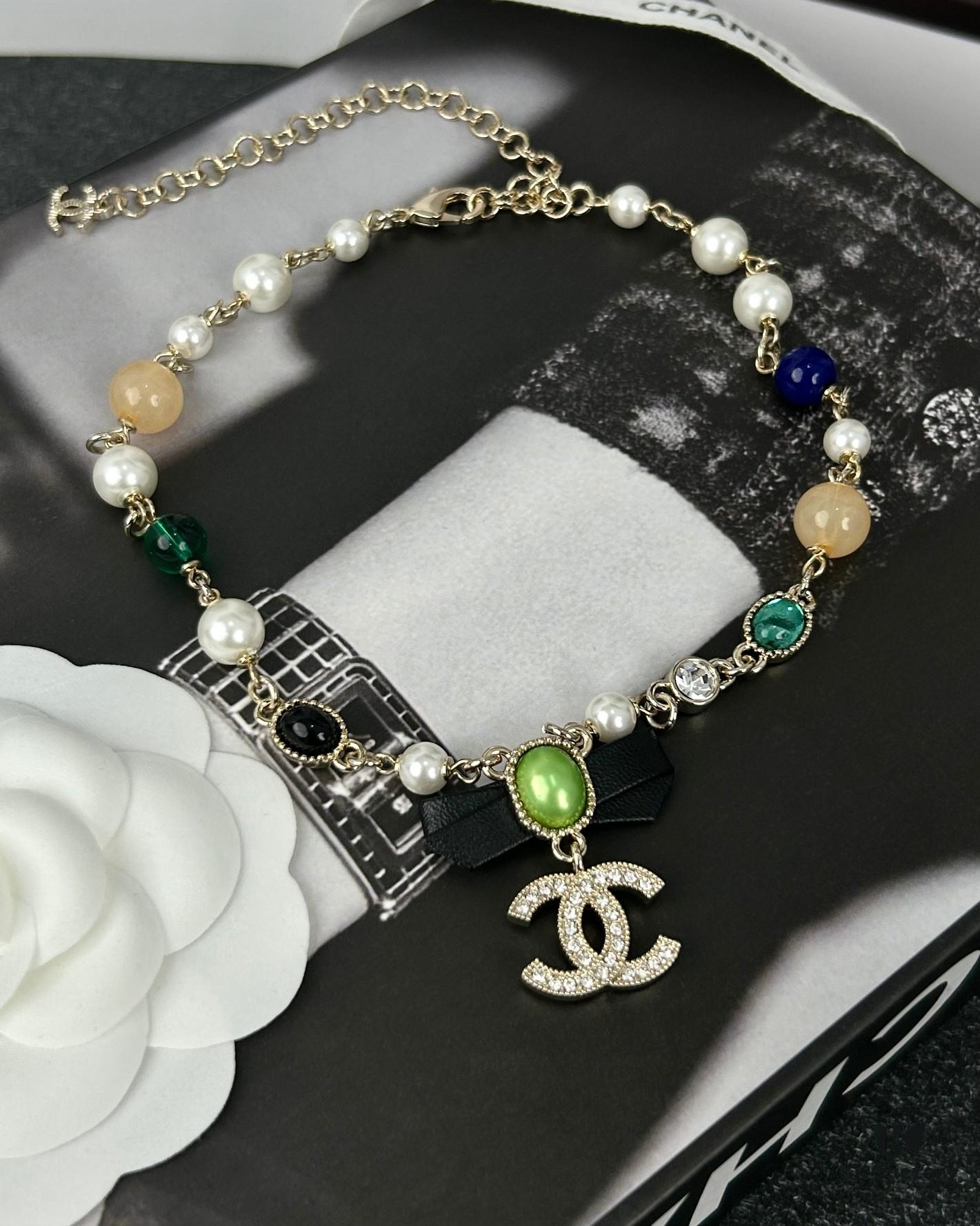 692ffdda99f2d84055c8e983 Xiaoxiang New Arrival Black Ribbon Bow with Green Pearl Pendant, Colorful Paved Diamond Necklace