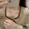692ffe2899f2d84055c8e9de CHANE New Style Black and White Button Round Semi-Pearl Half Chain Necklace