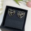 692ffe4c99f2d84055c8ea06 Chanel New Arrival Black Enamel Heart Earrings