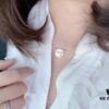6930006699f2d84055c8ec40 Crossed Mother-of-Pearl Necklace
