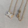 693001bc99f2d84055c8ed93 Cross Necklace in Rose Gold with White Shell, Chu Shang Mei Paris, Palladium Plated + 0.5 Version, 37.5-41.5cm, Full V-Gold with Natural Deep-Sea White Shell, Individually Carved Stone Setting, Center Inlaid with Premium Silicon Titanium Material