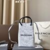 693002b312f62673a6faabfb Balenciaga Mini Tote Bag Limited Edition at Boutique, Featured by Entertainment Weekly - Stylish Black and White Design