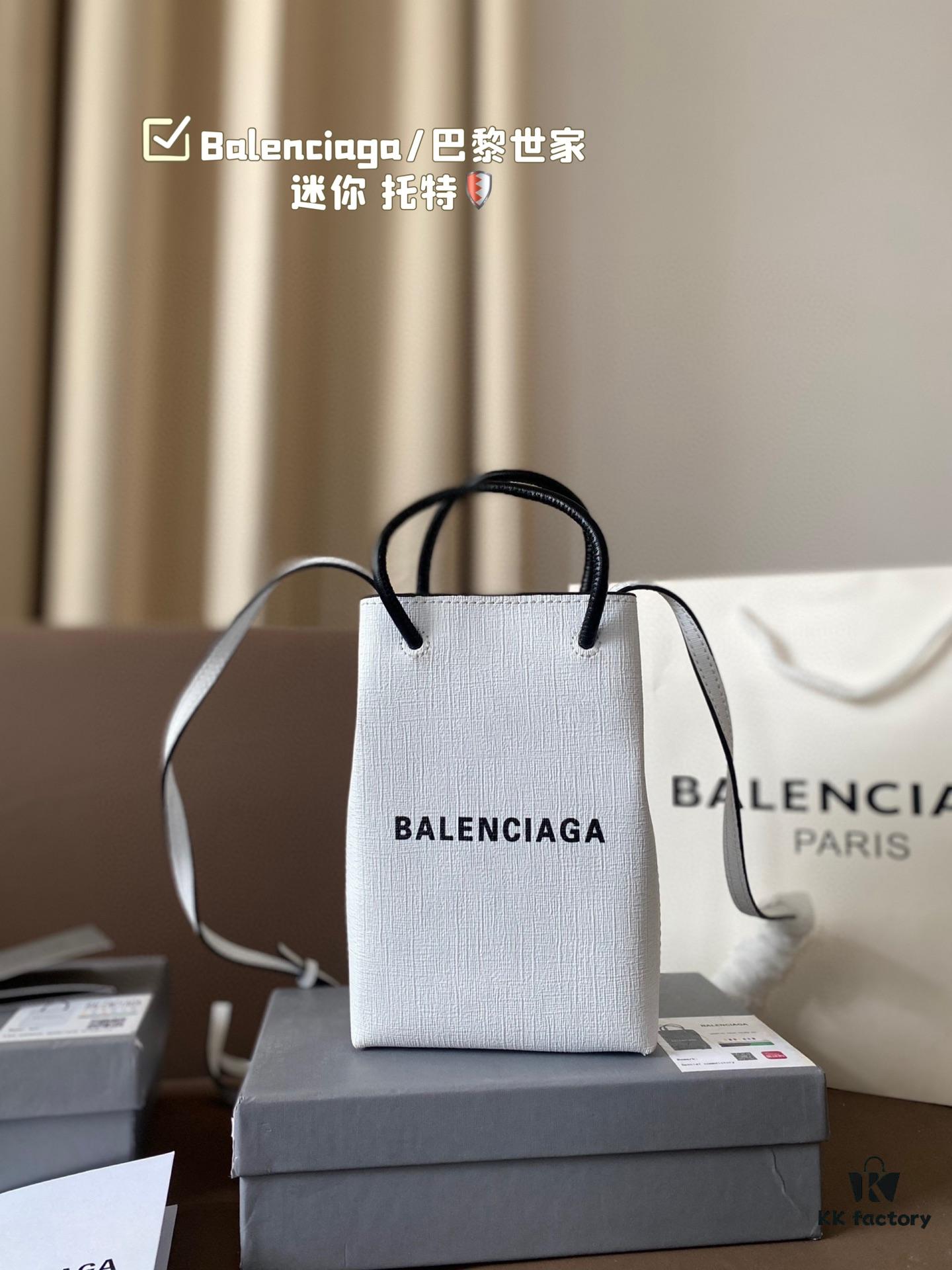 693002b312f62673a6faabfb Balenciaga Mini Tote Bag Limited Edition at Boutique, Featured by Entertainment Weekly - Stylish Black and White Design