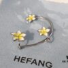 693004ea12f62673a6fab0bb HEFANG Jewelry Frangipani Huggie Earrings