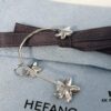 693004eb12f62673a6fab0c0 HEFANG Jewelry Frangipani Huggie Earrings