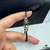 693005f912f62673a6fab202 FRED Fred Bracelet, Medium Rose Gold Force 10 Collection with Black and White Gemstones, Steel Cord Bracelet
