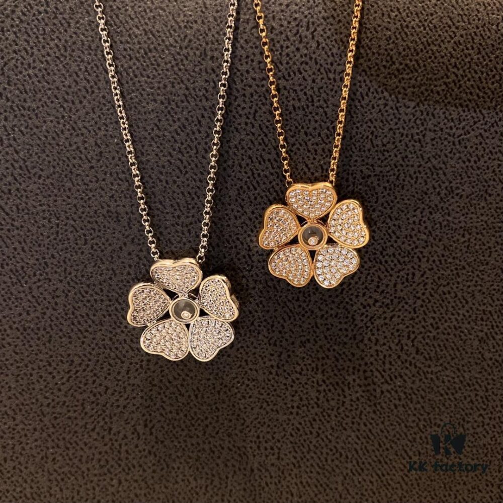6930074112f62673a6fab3e0 Chopard Happy Hearts Flowers Necklace featuring a signature heart motif adorned with five diamond petals encircling a dancing diamond, exuding elegance and charm
