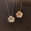 6930074112f62673a6fab3e0 Chopard Happy Hearts Flowers Necklace featuring a signature heart motif adorned with five diamond petals encircling a dancing diamond, exuding elegance and charm