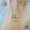 6930074312f62673a6fab3e4 Chopard Happy Hearts Flowers Necklace featuring a signature heart motif adorned with five diamond petals encircling a dancing diamond, exuding elegance and charm