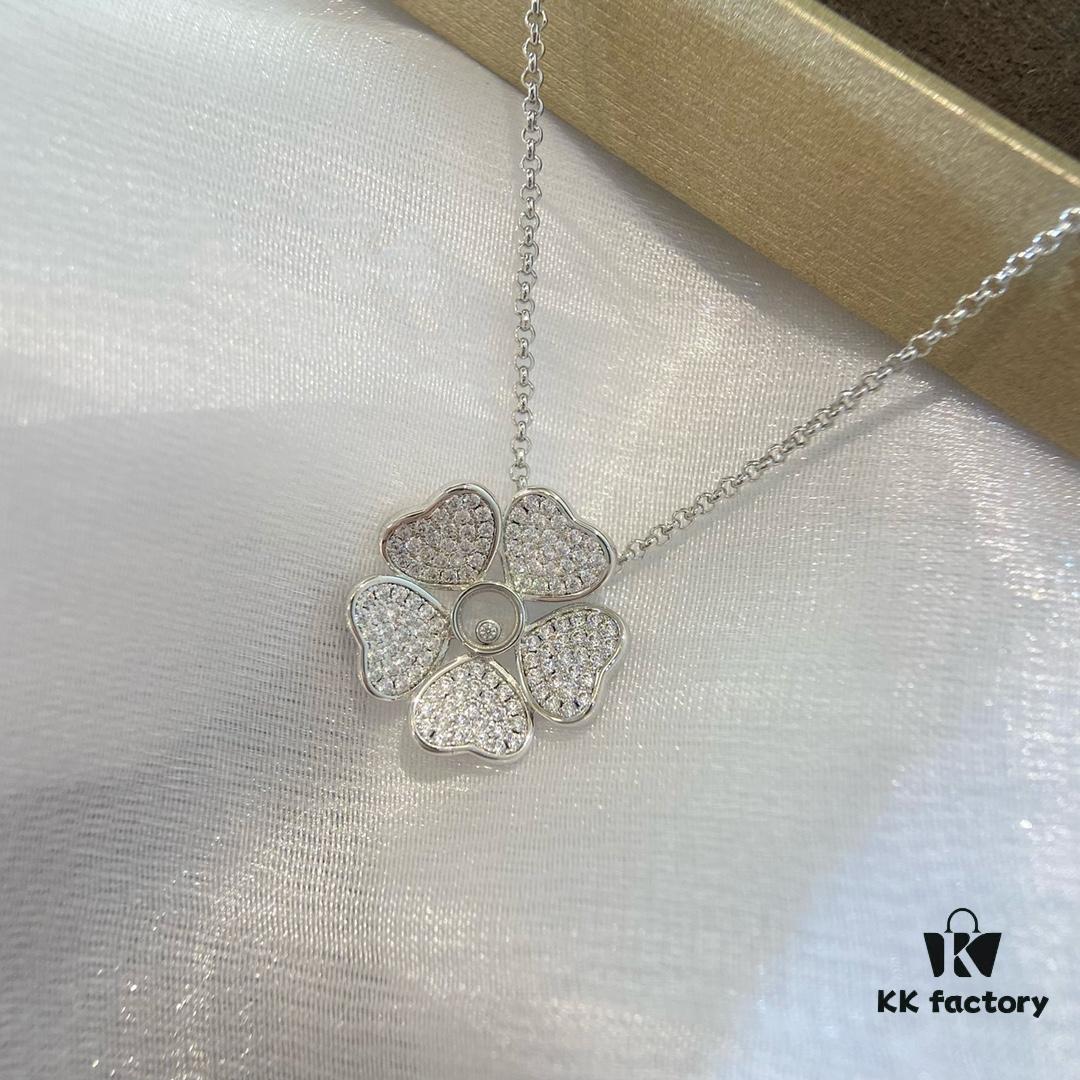 6930074412f62673a6fab3e7 Chopard Happy Hearts Flowers Necklace featuring a signature heart motif adorned with five diamond petals encircling a dancing diamond, exuding elegance and charm