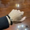 693007c912f62673a6fab4bd Chrome Hearts Obsidian Bracelet with Cross and Ball Detail