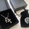 693007e912f62673a6fab4e9 Essential for Fashion-Forward Individuals: Double Cross Silver Necklace, Polished and Diamond-Faced, Reversible and Detachable Design