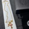 693007f812f62673a6fab501 Kuroki Must-Have for Streetwear Enthusiasts: Colorful Diamond-Paved Brooch Cross Necklace, Pink Diamond Front and Smooth Back, Reversible and Detachable Design