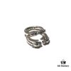 693008ce12f62673a6fab69b Chrome Hearts Double Dragon Dog Head Ring with Adjustable Open Design and Embossed Lettering Details