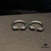 693008d012f62673a6fab69e Chrome Hearts Double Dragon Dog Head Ring with Adjustable Open Design and Embossed Lettering Details