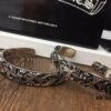 693008df12f62673a6fab6c3 Chrome Hearts Wide Open Bangle Bracelet with Vintage Gothic Cross Design