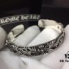693008e212f62673a6fab6c9 Chrome Hearts Wide Open Bangle Bracelet with Vintage Gothic Cross Design