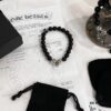 6930095a12f62673a6fab7ca Chrome Hearts Obsidian and Sterling Silver Bead Bracelet with Four Cross Charms